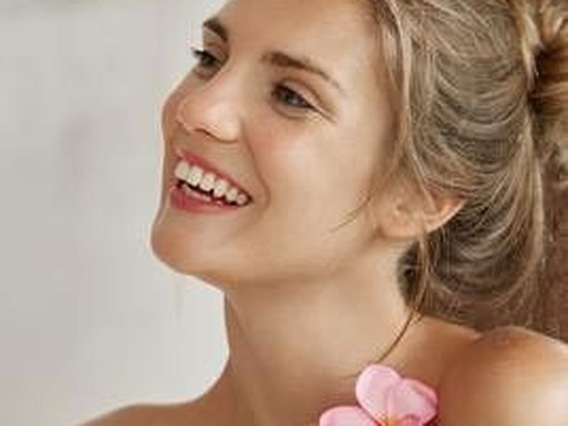Client smiling after a DaVinci teeth whitening session
