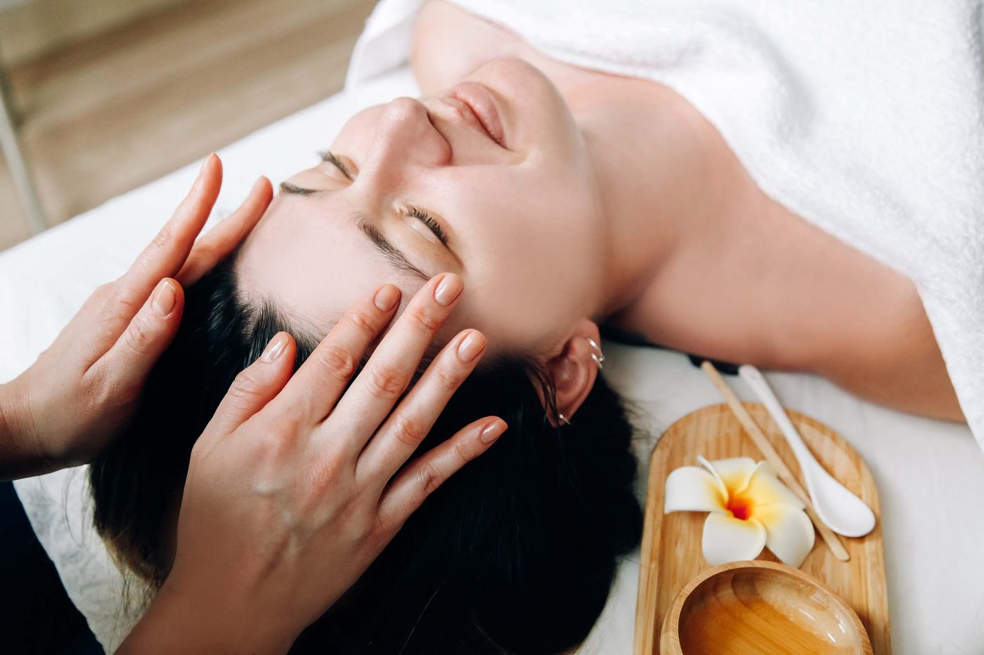 Esthetician performing a hydrating facial massage