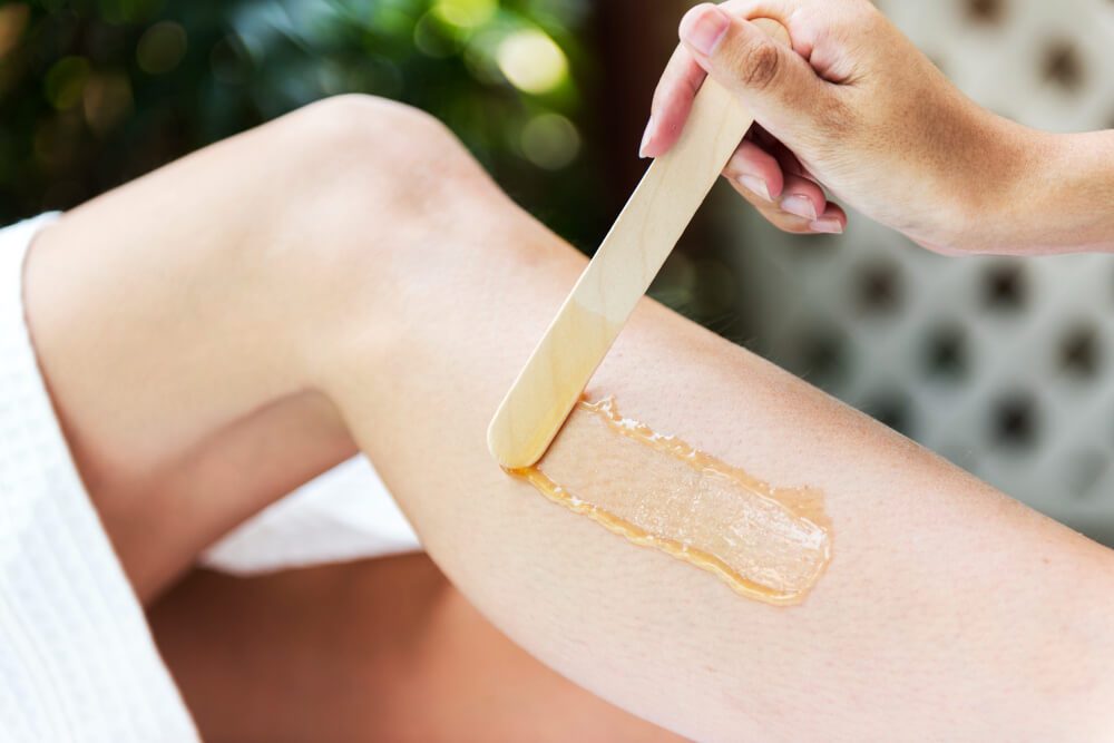 Leg waxing treatment being performed at Stillwater Wellness, Commerce City CO
